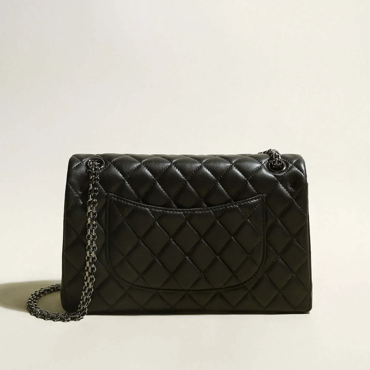 Capacious Black Quilted Bag with Metallic Chain Straps