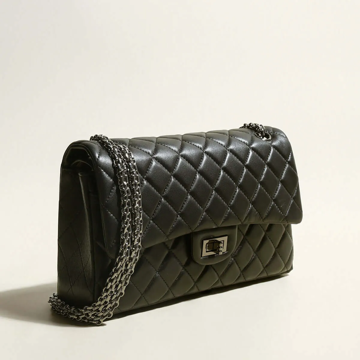 Capacious Black Quilted Bag with Metallic Chain Straps