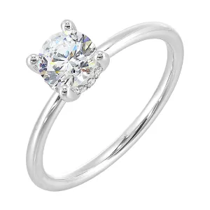 The dazzling solitaire diamond take center stage. The petite band adds to the sleek, classic look.